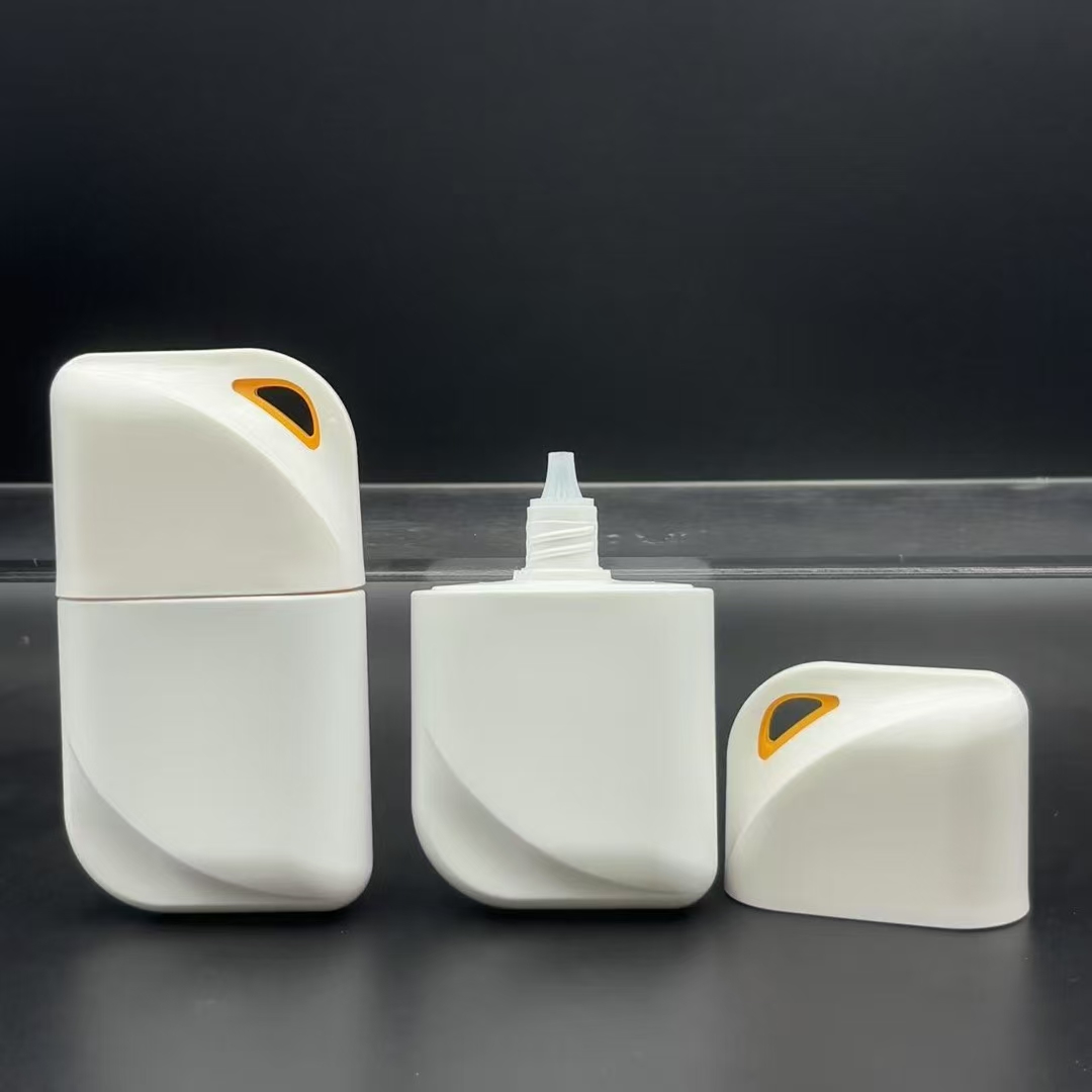 A close-up of a thick, clear sunscreen bottle made with recycled plastic, featuring elegant screen-printed branding